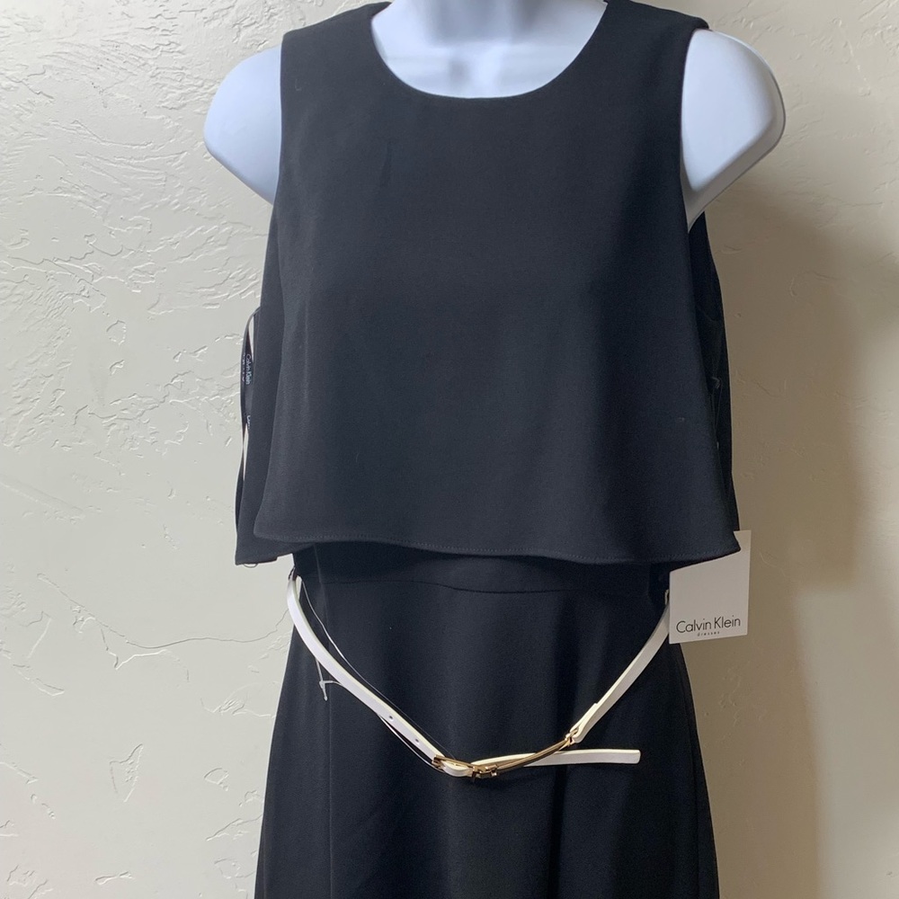 Black mid length dress with white belt